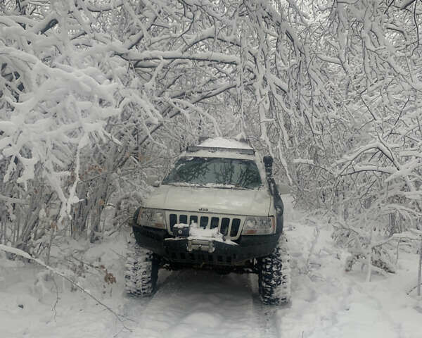 Білий Джип Grand Cherokee, об'ємом двигуна 4.7 л та пробігом 245 тис. км за 12500 $, фото 7 на Automoto.ua