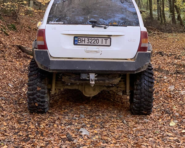 Білий Джип Grand Cherokee, об'ємом двигуна 4.7 л та пробігом 245 тис. км за 12500 $, фото 13 на Automoto.ua