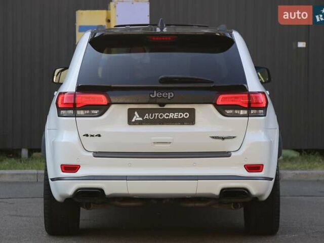 Белый Джип Гранд Чероки, объемом двигателя 5.65 л и пробегом 80 тыс. км за 35900 $, фото 5 на Automoto.ua