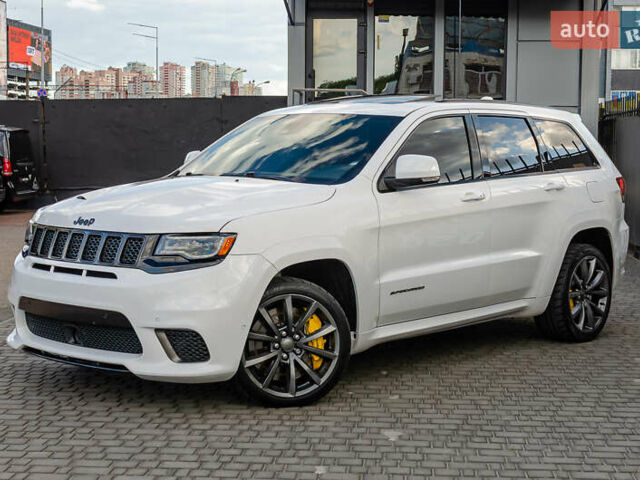 Білий Джип Grand Cherokee, об'ємом двигуна 6.2 л та пробігом 148 тис. км за 57700 $, фото 1 на Automoto.ua