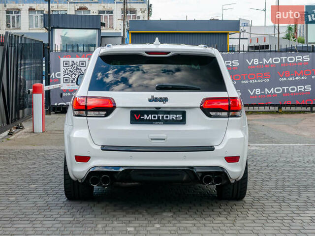 Білий Джип Grand Cherokee, об'ємом двигуна 6.2 л та пробігом 148 тис. км за 57700 $, фото 9 на Automoto.ua