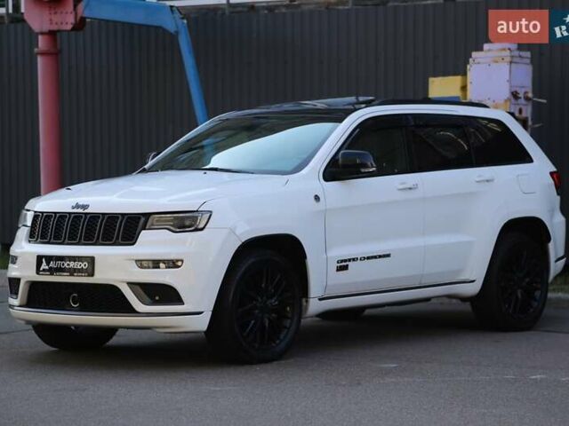 Белый Джип Гранд Чероки, объемом двигателя 5.65 л и пробегом 80 тыс. км за 35900 $, фото 2 на Automoto.ua