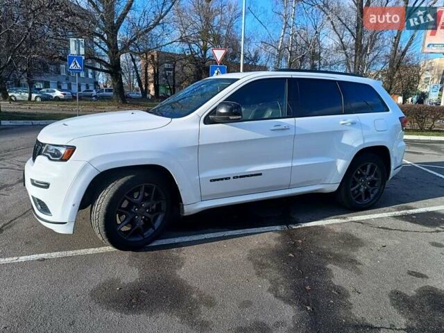 Белый Джип Гранд Чероки, объемом двигателя 5.65 л и пробегом 154 тыс. км за 28900 $, фото 3 на Automoto.ua