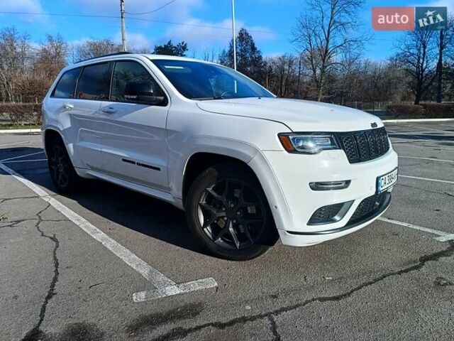 Белый Джип Гранд Чероки, объемом двигателя 5.65 л и пробегом 154 тыс. км за 28900 $, фото 2 на Automoto.ua