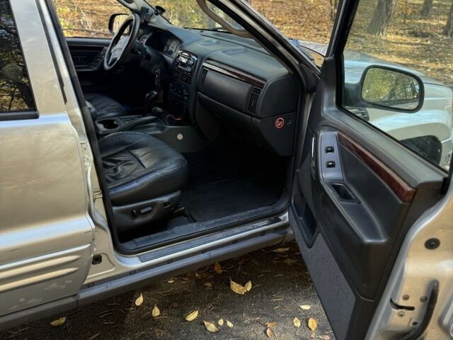 Джип Grand Cherokee 2002 у Києві на Automoto.ua Бежевий Джип Grand Cherokee, об'ємом двигуна 1.2 л та пробігом 280 тис. км за 3700 $, фото 11 на Automoto.ua