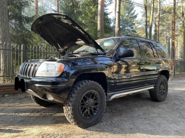 Чорний Джип Grand Cherokee, об'ємом двигуна 2.4 л та пробігом 270 тис. км за 10500 $, фото 2 на Automoto.ua
