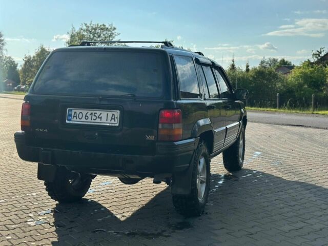 Черный Джип Гранд Чероки, объемом двигателя 5.2 л и пробегом 345 тыс. км за 5900 $, фото 6 на Automoto.ua