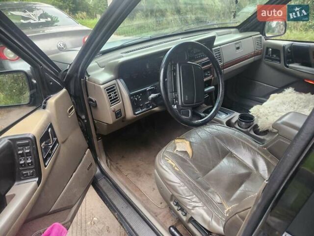Чорний Джип Grand Cherokee, об'ємом двигуна 5.2 л та пробігом 350 тис. км за 5000 $, фото 4 на Automoto.ua