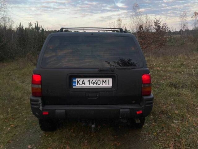 Черный Джип Гранд Чероки, объемом двигателя 4 л и пробегом 400 тыс. км за 2900 $, фото 5 на Automoto.ua