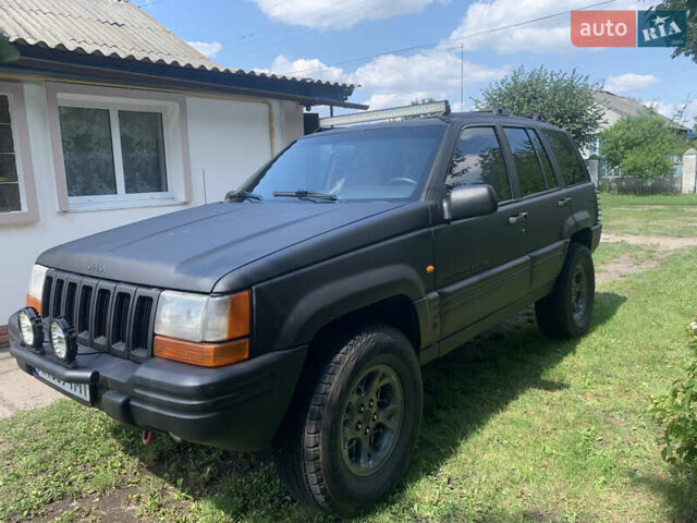 Черный Джип Гранд Чероки, объемом двигателя 4 л и пробегом 399 тыс. км за 6500 $, фото 1 на Automoto.ua