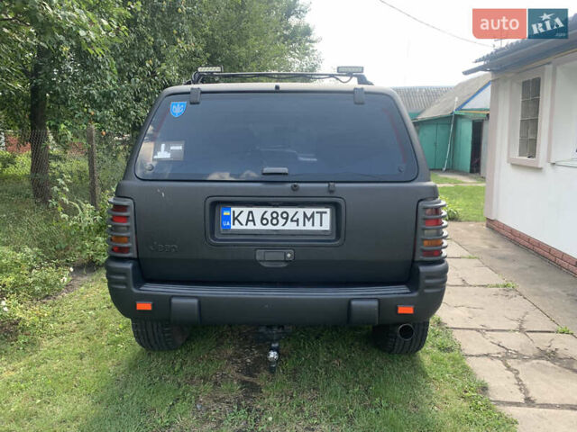 Черный Джип Гранд Чероки, объемом двигателя 4 л и пробегом 399 тыс. км за 6500 $, фото 4 на Automoto.ua