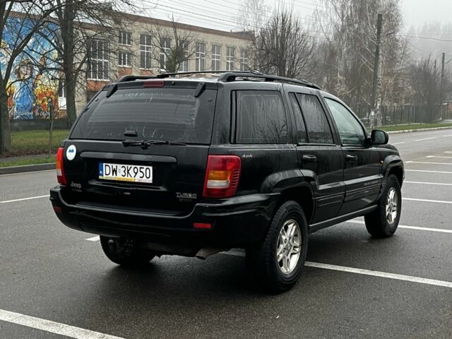 Черный Джип Гранд Чероки, объемом двигателя 3.1 л и пробегом 430 тыс. км за 3500 $, фото 3 на Automoto.ua