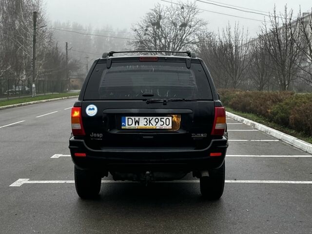 Черный Джип Гранд Чероки, объемом двигателя 3.1 л и пробегом 430 тыс. км за 3500 $, фото 4 на Automoto.ua