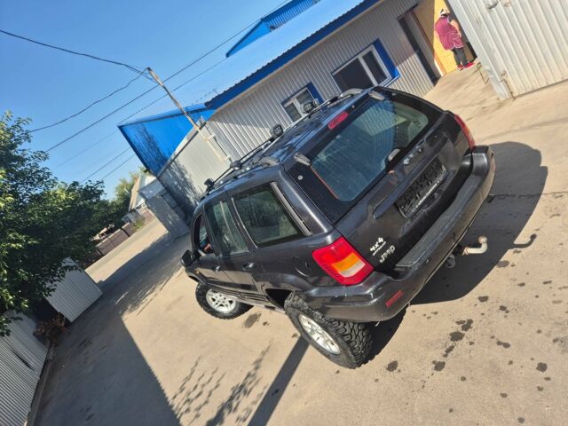 Черный Джип Гранд Чероки, объемом двигателя 3.1 л и пробегом 279 тыс. км за 6850 $, фото 6 на Automoto.ua