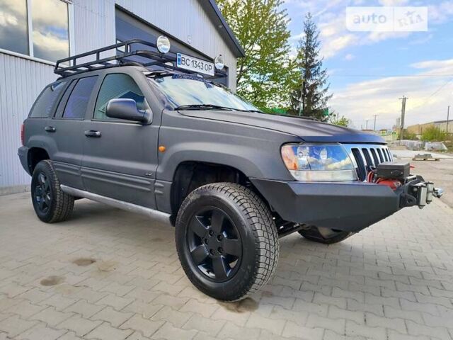 Чорний Джип Grand Cherokee, об'ємом двигуна 3.12 л та пробігом 163 тис. км за 9500 $, фото 1 на Automoto.ua