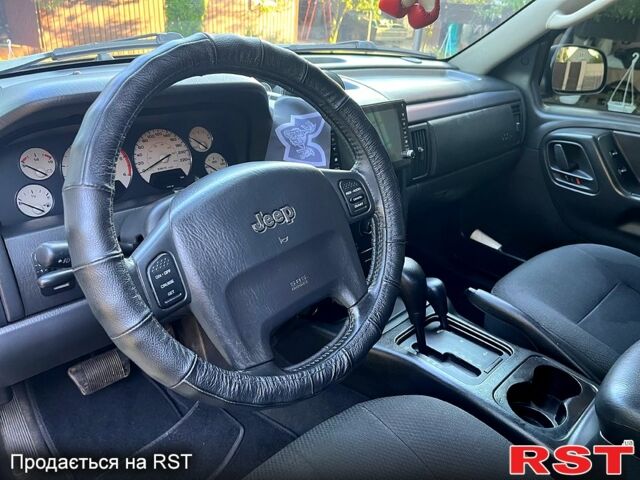 Джип Гранд Чероки 2002 в Днепре (Днепропетровске) на Automoto.ua Черный Джип Гранд Чероки, объемом двигателя 2.7 л и пробегом 300 тыс. км за 5000 $, фото 4 на Automoto.ua