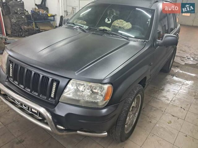 Чорний Джип Grand Cherokee, об'ємом двигуна 4 л та пробігом 294 тис. км за 5000 $, фото 1 на Automoto.ua