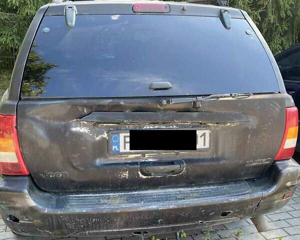Джип Гранд Чероки 2003 в Новоукраинке на Automoto.ua Черный Джип Гранд Чероки, объемом двигателя 2.69 л и пробегом 280 тыс. км за 4100 $, фото 2 на Automoto.ua