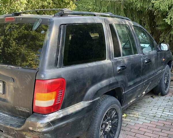 Джип Гранд Чероки 2003 в Новоукраинке на Automoto.ua Черный Джип Гранд Чероки, объемом двигателя 2.69 л и пробегом 280 тыс. км за 4100 $, фото 1 на Automoto.ua