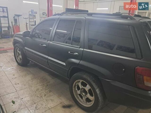 Чорний Джип Grand Cherokee, об'ємом двигуна 4 л та пробігом 294 тис. км за 5000 $, фото 4 на Automoto.ua