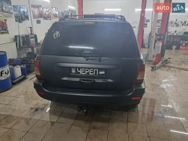 Чорний Джип Grand Cherokee, об'ємом двигуна 4 л та пробігом 294 тис. км за 5000 $, фото 2 на Automoto.ua