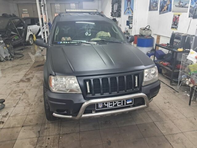 Черный Джип Гранд Чероки, объемом двигателя 4 л и пробегом 217 тыс. км за 4500 $, фото 1 на Automoto.ua