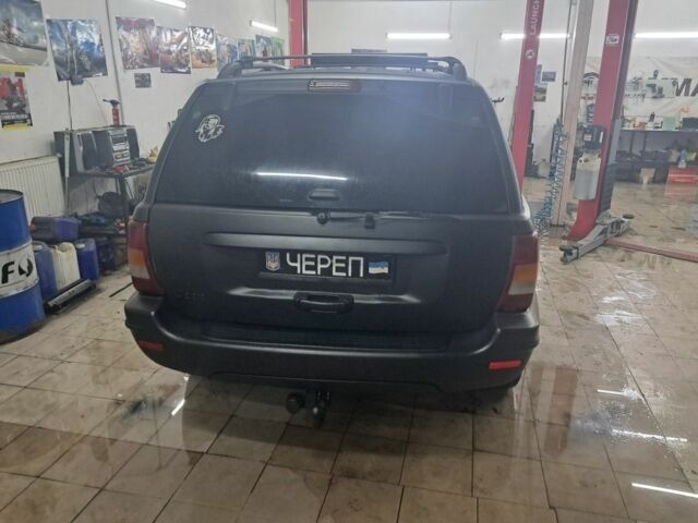 Черный Джип Гранд Чероки, объемом двигателя 4 л и пробегом 217 тыс. км за 4500 $, фото 3 на Automoto.ua