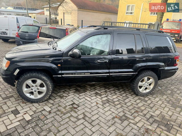 Черный Джип Гранд Чероки, объемом двигателя 2.7 л и пробегом 221 тыс. км за 3142 $, фото 2 на Automoto.ua