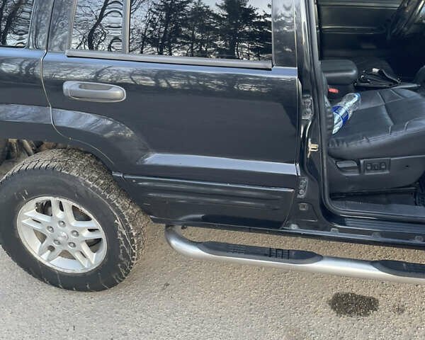 Чорний Джип Grand Cherokee, об'ємом двигуна 4 л та пробігом 120 тис. км за 5900 $, фото 17 на Automoto.ua