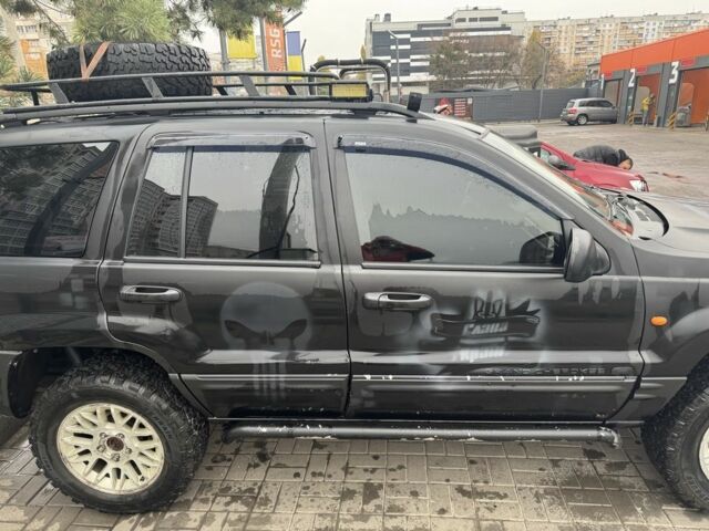 Черный Джип Гранд Чероки, объемом двигателя 2.7 л и пробегом 370 тыс. км за 6000 $, фото 2 на Automoto.ua