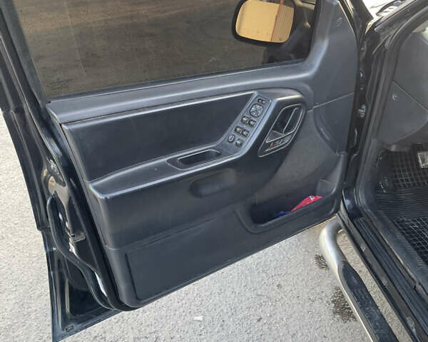 Чорний Джип Grand Cherokee, об'ємом двигуна 4 л та пробігом 120 тис. км за 5900 $, фото 6 на Automoto.ua