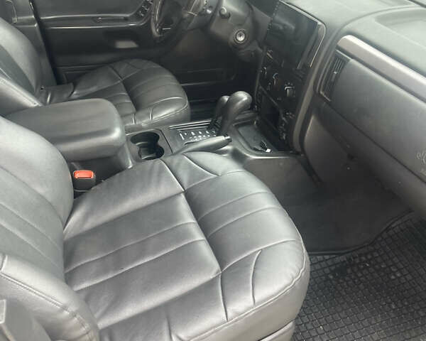 Чорний Джип Grand Cherokee, об'ємом двигуна 4 л та пробігом 125 тис. км за 7000 $, фото 6 на Automoto.ua