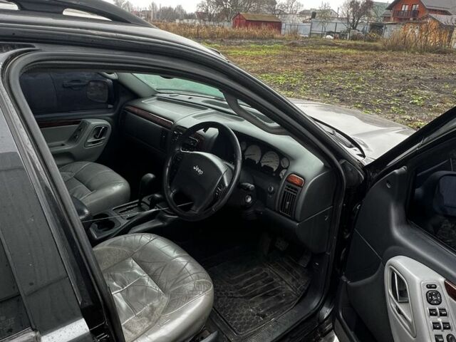 Черный Джип Гранд Чероки, объемом двигателя 2.7 л и пробегом 300 тыс. км за 2837 $, фото 4 на Automoto.ua