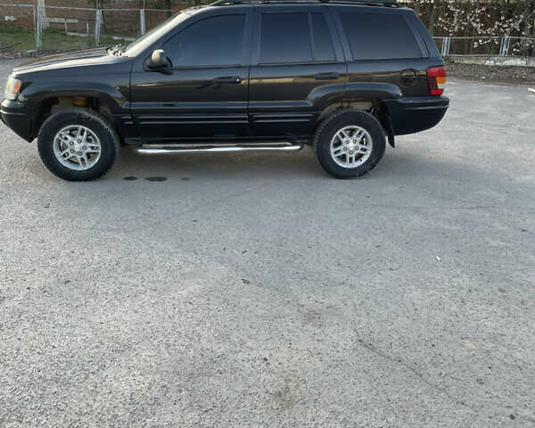 Чорний Джип Grand Cherokee, об'ємом двигуна 4 л та пробігом 120 тис. км за 5900 $, фото 27 на Automoto.ua
