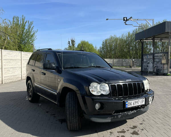 Черный Джип Гранд Чероки, объемом двигателя 3.7 л и пробегом 305 тыс. км за 11000 $, фото 2 на Automoto.ua