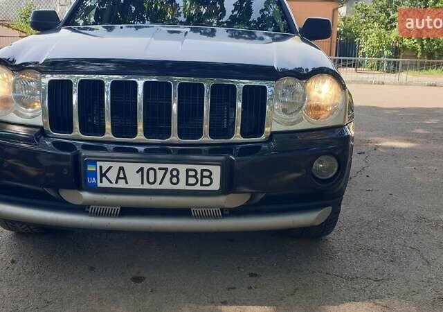 Черный Джип Гранд Чероки, объемом двигателя 5.65 л и пробегом 158 тыс. км за 12300 $, фото 6 на Automoto.ua