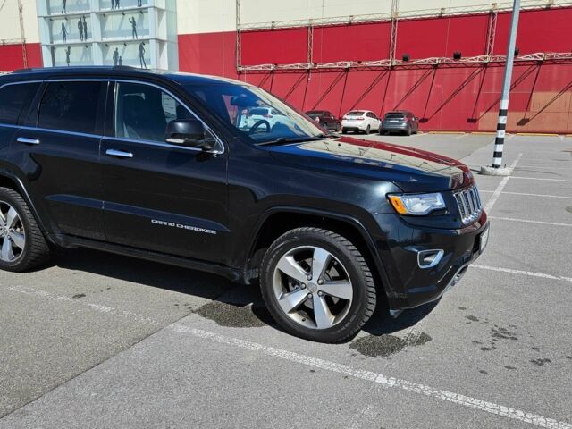 Черный Джип Гранд Чероки, объемом двигателя 5.7 л и пробегом 180 тыс. км за 22500 $, фото 1 на Automoto.ua