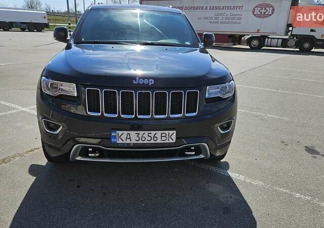 Черный Джип Гранд Чероки, объемом двигателя 5.65 л и пробегом 180 тыс. км за 22500 $, фото 2 на Automoto.ua