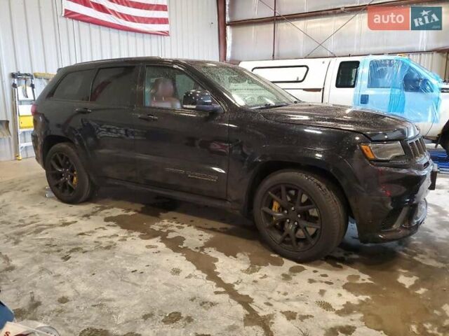 Черный Джип Гранд Чероки, объемом двигателя 6.2 л и пробегом 131 тыс. км за 4300 $, фото 3 на Automoto.ua