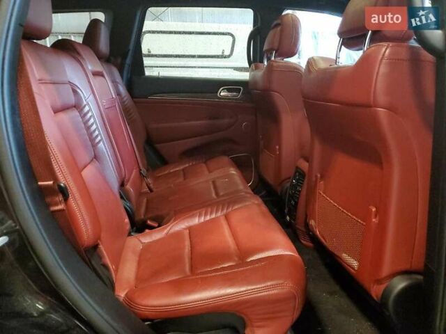 Черный Джип Гранд Чероки, объемом двигателя 6.2 л и пробегом 131 тыс. км за 4300 $, фото 9 на Automoto.ua