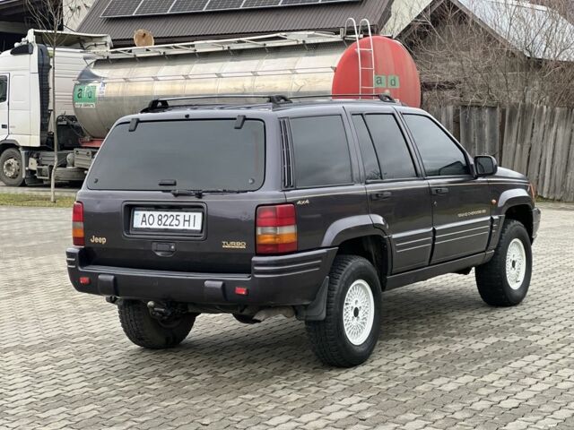 Фиолетовый Джип Гранд Чероки, объемом двигателя 2.5 л и пробегом 300 тыс. км за 5200 $, фото 8 на Automoto.ua