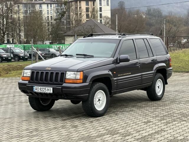 Фиолетовый Джип Гранд Чероки, объемом двигателя 2.5 л и пробегом 300 тыс. км за 5200 $, фото 4 на Automoto.ua