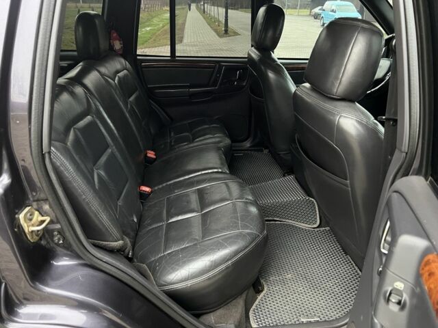 Фиолетовый Джип Гранд Чероки, объемом двигателя 2.5 л и пробегом 300 тыс. км за 5200 $, фото 21 на Automoto.ua