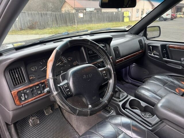 Фиолетовый Джип Гранд Чероки, объемом двигателя 2.5 л и пробегом 300 тыс. км за 5200 $, фото 16 на Automoto.ua