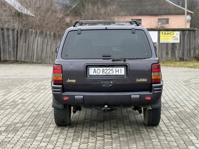 Фиолетовый Джип Гранд Чероки, объемом двигателя 2.5 л и пробегом 300 тыс. км за 5200 $, фото 7 на Automoto.ua