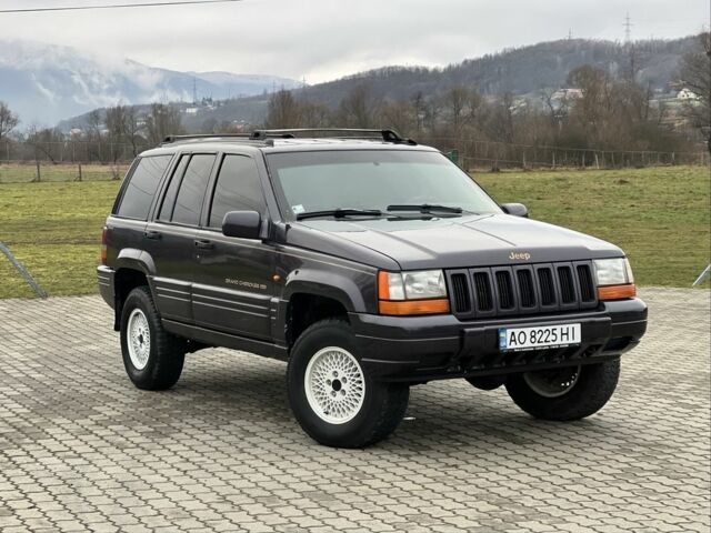 Фиолетовый Джип Гранд Чероки, объемом двигателя 2.5 л и пробегом 300 тыс. км за 5200 $, фото 1 на Automoto.ua