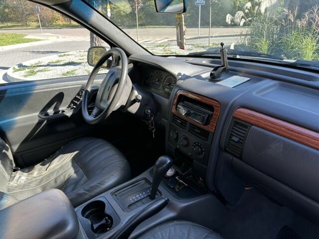 Коричневий Джип Grand Cherokee, об'ємом двигуна 4 л та пробігом 300 тис. км за 1900 $, фото 4 на Automoto.ua