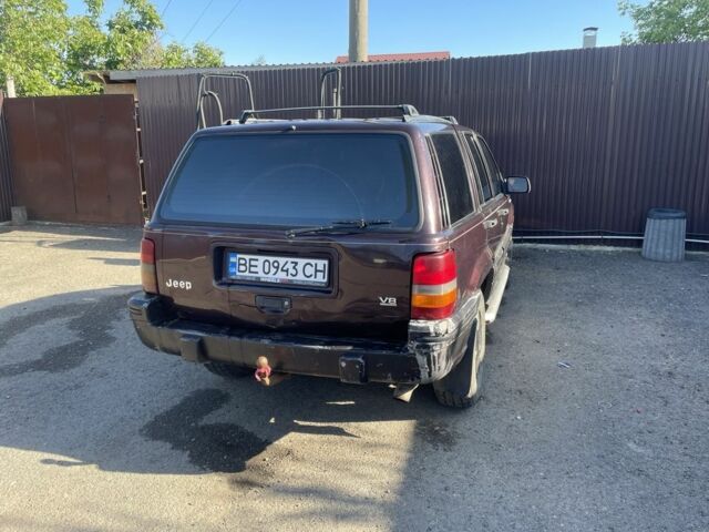 Красный Джип Гранд Чероки, объемом двигателя 5.2 л и пробегом 270 тыс. км за 3100 $, фото 4 на Automoto.ua