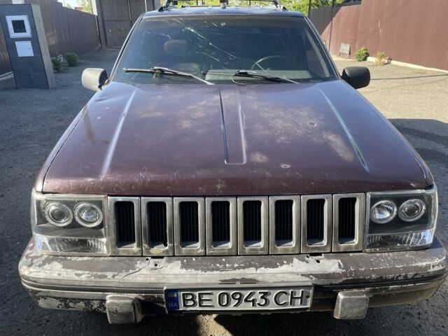 Красный Джип Гранд Чероки, объемом двигателя 5.2 л и пробегом 270 тыс. км за 3100 $, фото 2 на Automoto.ua