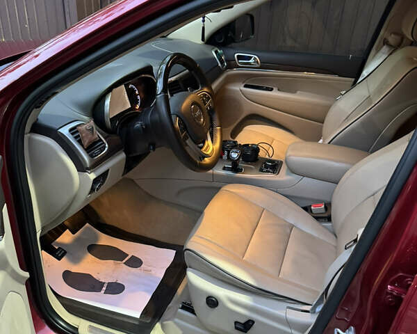 Красный Джип Гранд Чероки, объемом двигателя 5.65 л и пробегом 170 тыс. км за 20000 $, фото 5 на Automoto.ua